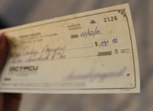 Signed paycheck that leads to songs about payday.