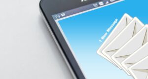 Close-up of smartphone screen with email message notification.