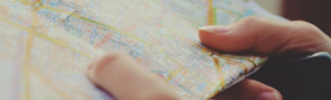 Traveling employee studies map using map app.