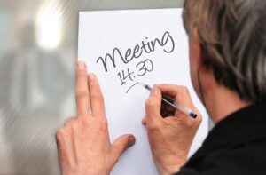 Professional tracking time spent for meeting.