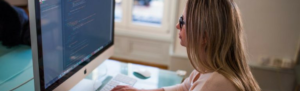 Remote workers works from home office logged into Fingercheck to record worked hours.