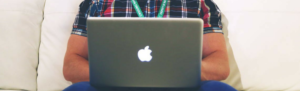 Person uses Fingercheck's new announcements tool on mac laptop.
