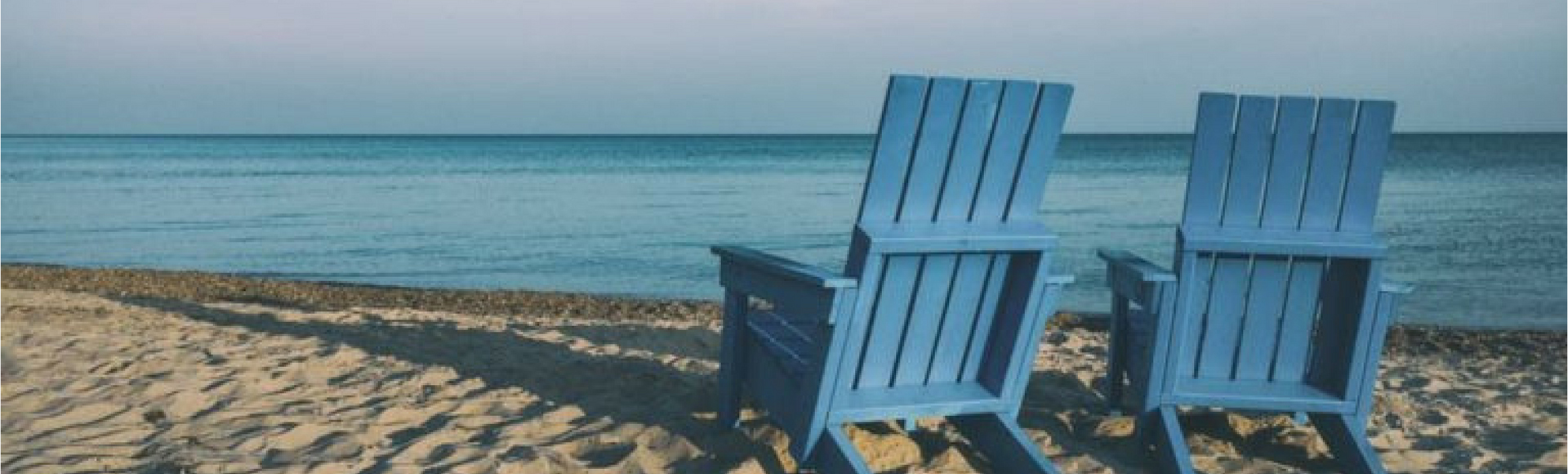 two benches on the beach