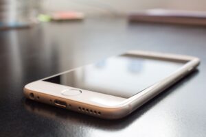 iPhone loaded with new Fingercheck mobile app.
