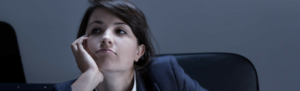 Unproductive employee slacks at desk on-the-job in order to collect overtime.