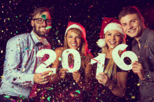 Work office party holding 2016 numbers in anticipation of resolutions to be made for the new year.