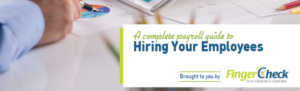 Businessman's hands tapping tablet with Payroll Guide for hiring new employees open.