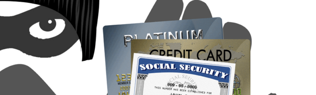 Identity theft prevention concept, mugger holds stolen social security card and credit card information stolen through tax scam.