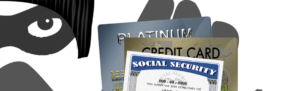 Identity theft prevention concept, mugger holds stolen social security card and credit card information stolen through tax scam.