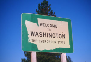 Welcome to Washington sign signifying Fingercheck adding Washington to covered payroll states.
