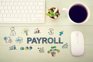 Keyboard, succulent, coffee cup, mouse, with PAYROLL illustrated on backdrop and currency, chart, and financial doodles surrounding for payroll advice.