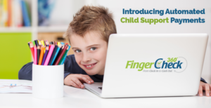 Boy in playroom grins from behind laptop at the news of Fingercheck's automatic child support payment options.