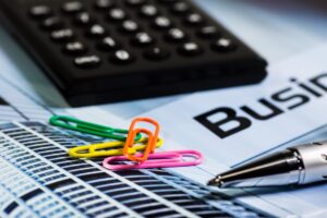 calculator paperclip pen office updated list of deadlines for filing W-2 and 1099 forms.