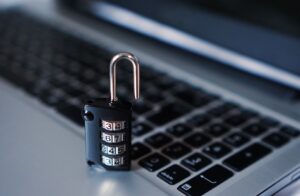 Security lock keyboard digital scam fraud theft concept.