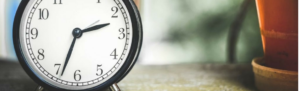 The hands of a time clock switching to reflect the beginning of Daylight Saving Time.