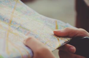 An employer holds a map viewing new FingerCheck payroll-approved states.