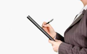 Woman in Gray Pinstripe Blazer Holding Black and Gray Stylus Pen and Black Pad