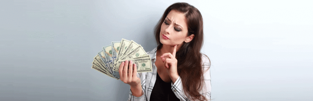 girl holding dollars